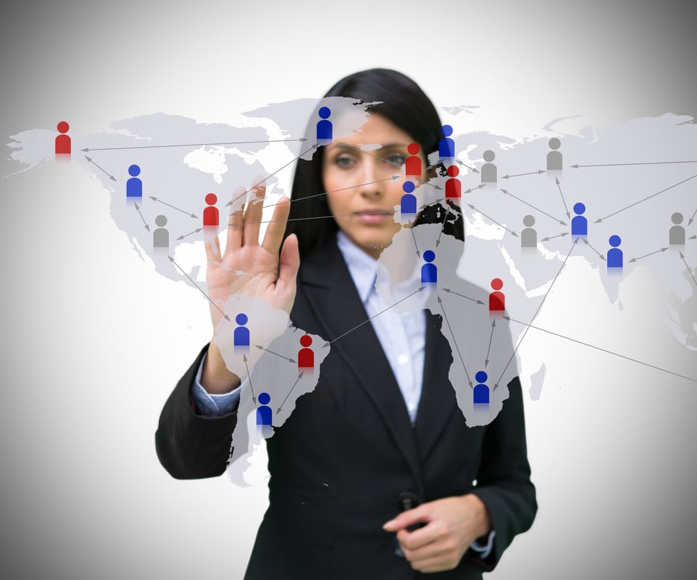 Businesswoman touching world map interface with figures
