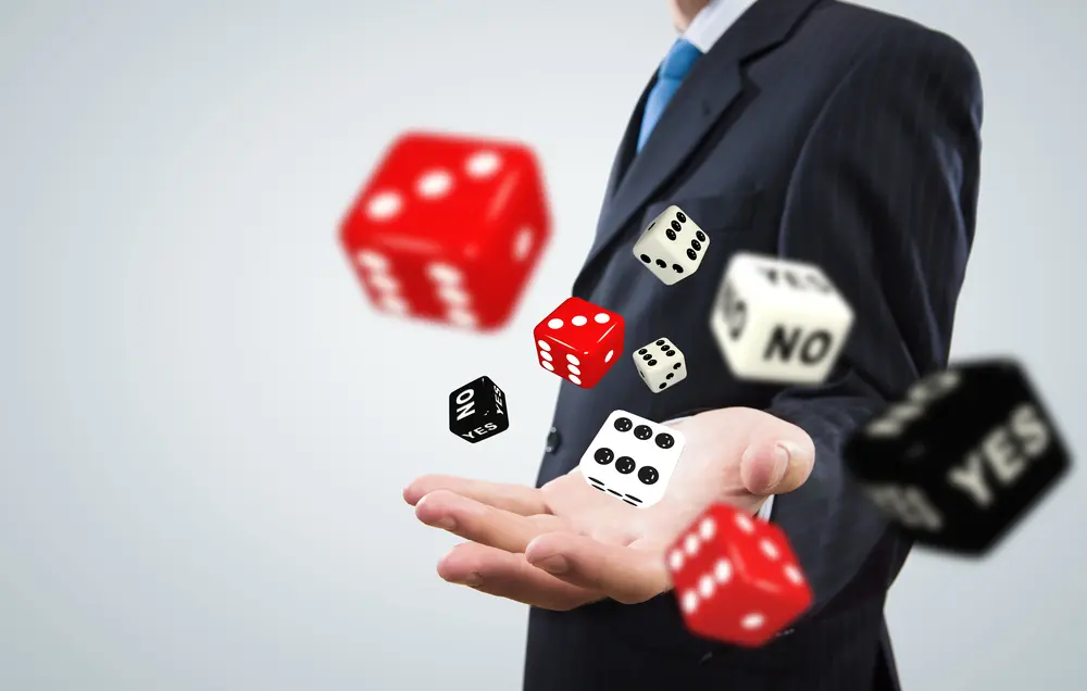 Close up of businessman throwing dice